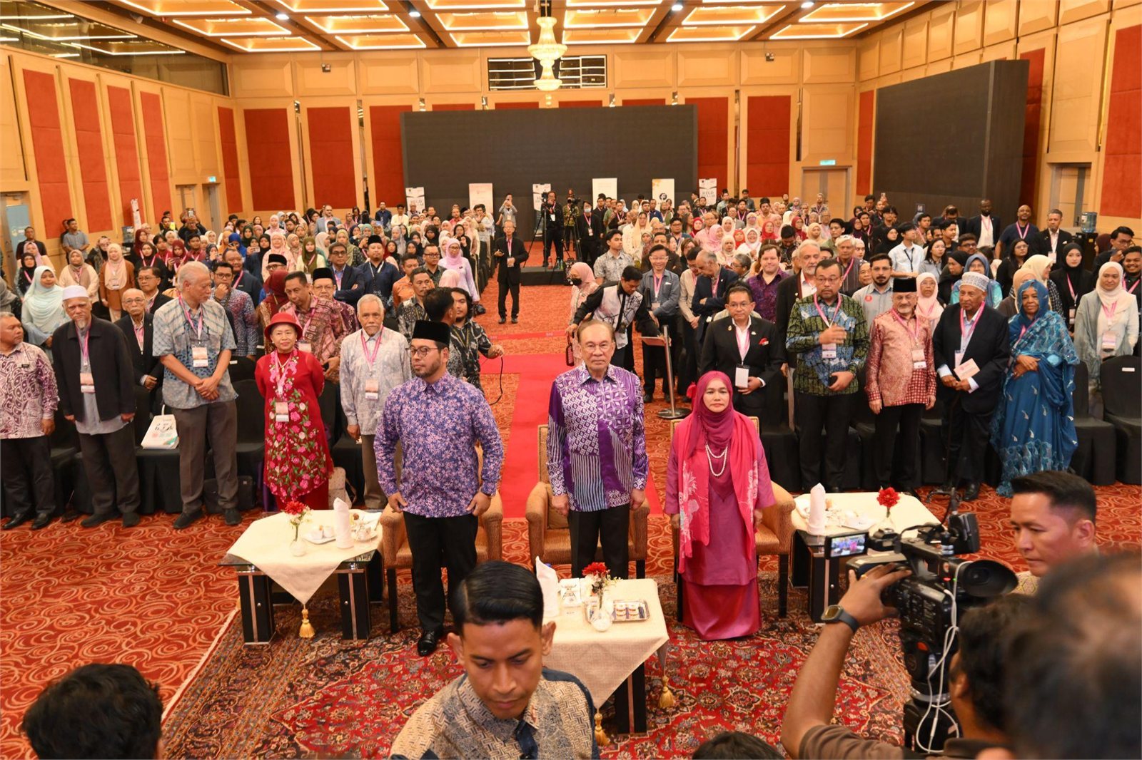 A packed hall of attendees and VIPs standing at the opening of HEGD 2026 in WTCKL
