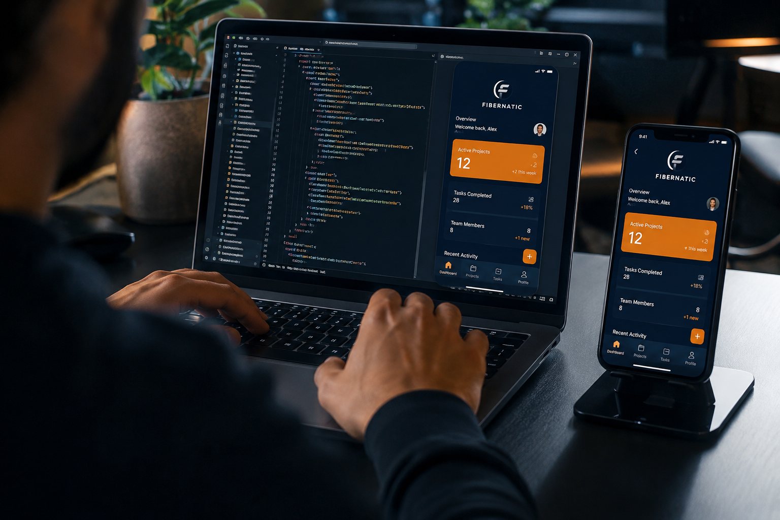 A developer building a native Fibernatic app, with the source code open on a laptop and the running app previewed on a phone alongside it